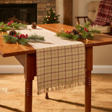 Simmons plaid table runner styled with Christmascenterpiece on farmhouse dining table
