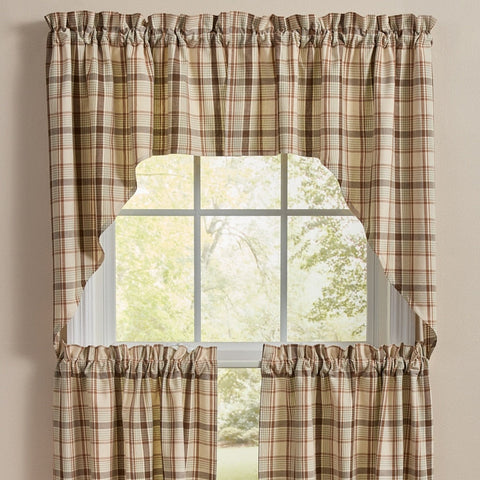 Toffee & Elm Plaid Swags, styled on a window against a neutral beige wall.