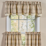 Toffee & Elm Plaid Layered Valance, featuring a cream, tan, green and brown checkered pattern, shown hanging on a white-framed window.