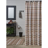A Barnwood plaid shower curtain hanging in a rustic bathroom setting with a white shiplap wall, a black mirror, a small table with decorative items, and a striped rug on the floor.