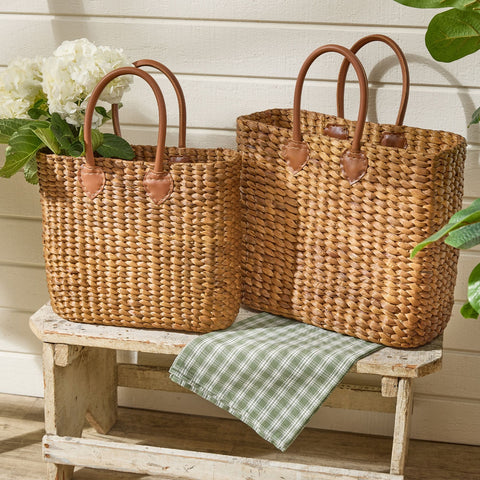 Brinkley Rattan Leather Handle Totes Set of 2 — front view, large tote, tan woven rattan with leather handles
2	