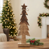 Christmas wooden tree figurine in a cozy Christmas setting