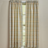 Sage & Mustard Plaid Short Panel Curtains 63" hanging in front of a window with a beige wall background