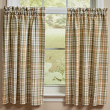 Sage & Mustard Plaid Cafe Tier Curtains 36" hanging in front of a window with a view of greenery outside.