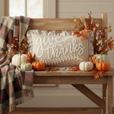 Graycie Give Thanks Fall Accent Pillow 22x14 styled in a cozy farmhouse room setting with plaid throw and fall decor accents