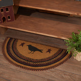 Heirloom Farm Primitive Crow Half Circle Rug styled at base of wooden staircase with primitive crow and star stencil on mustard tan jute braid