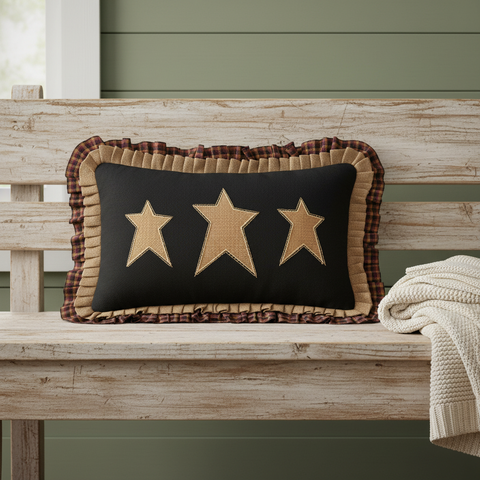 Heirloom Farm Primitive Stars Pillow on a farmhouse bench