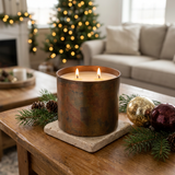 Homestead Medium Tumbler Candle with two lit wicks in a Christmas setting