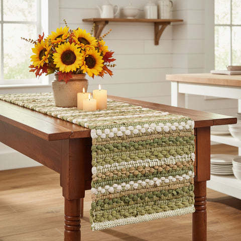 Pear Grove Chindi Table Runner styled on a farmhouse wood dining table with sunflowers and pillar candles in a farmhouse shiplap kitchen