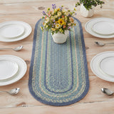 Sea Glass Braided Table Runner blue and green table runner with a floral arrangement on a wooden table.