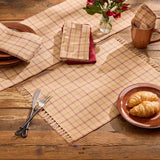 Simmons plaid placemats, table runner, and napkins styled on a farmhouse dining table
