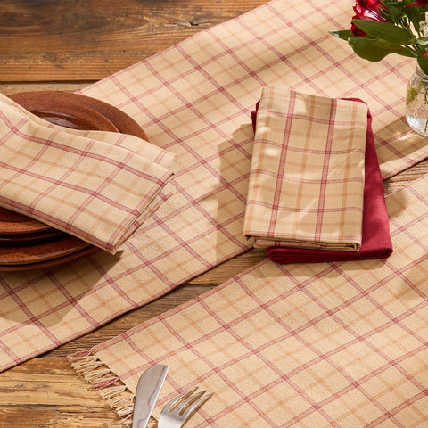 Simmons plaid cloth napkins folded and styled on a farmhouse dining table place setting
