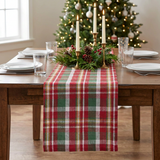 Sleigh Bell Plaid Table Runner Christmas scene with lit candles