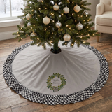 Winter Blessings Tree Skirt beneath a Christmas tree