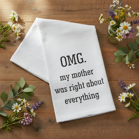 OMG My Mother Was Right About Everything Flour Sack Towel folded on a wood surface surrounded by wildflowers and lavender